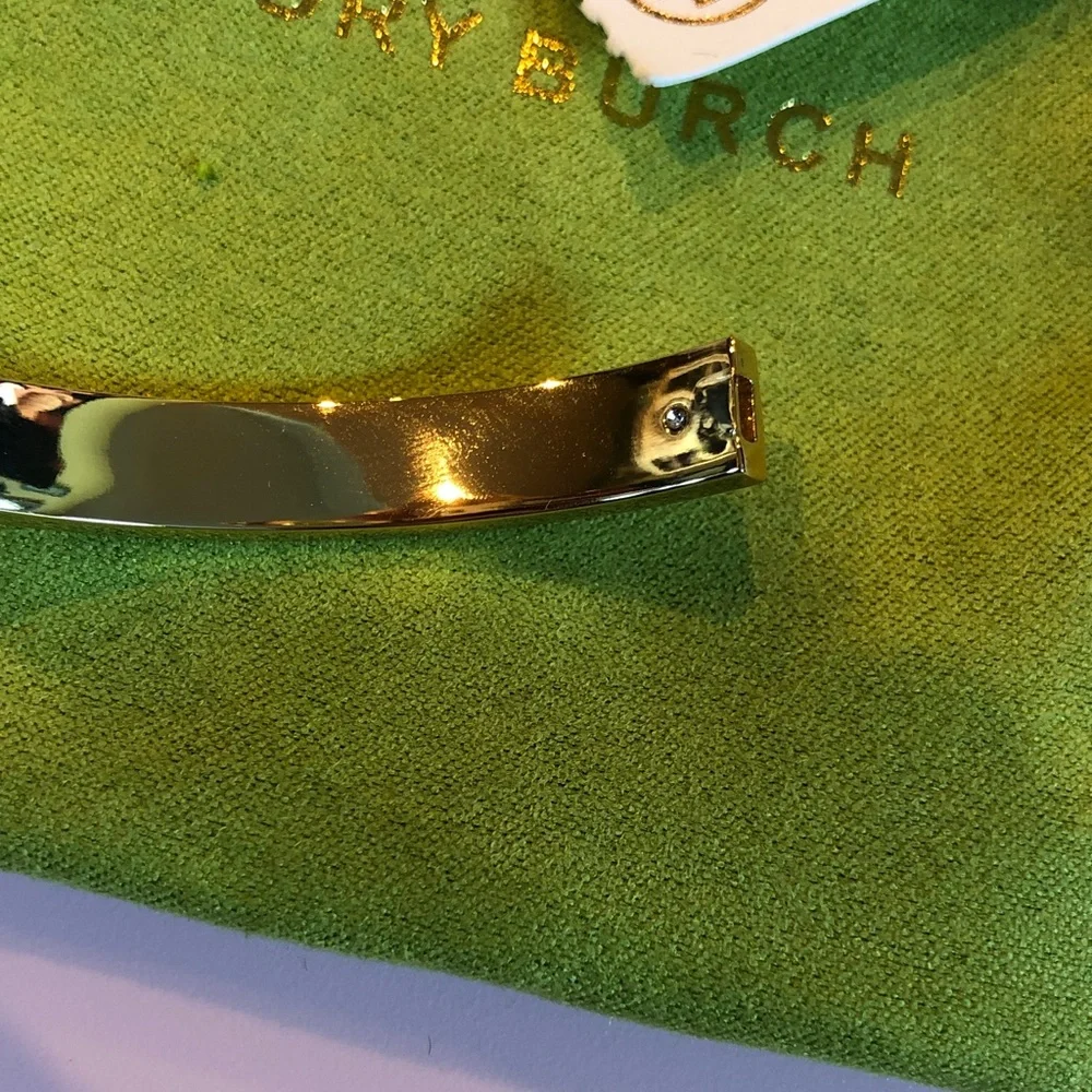 Authentic Tory Burch New/tag and pouch. Enamel Floral Hinge gold tone bracelet.